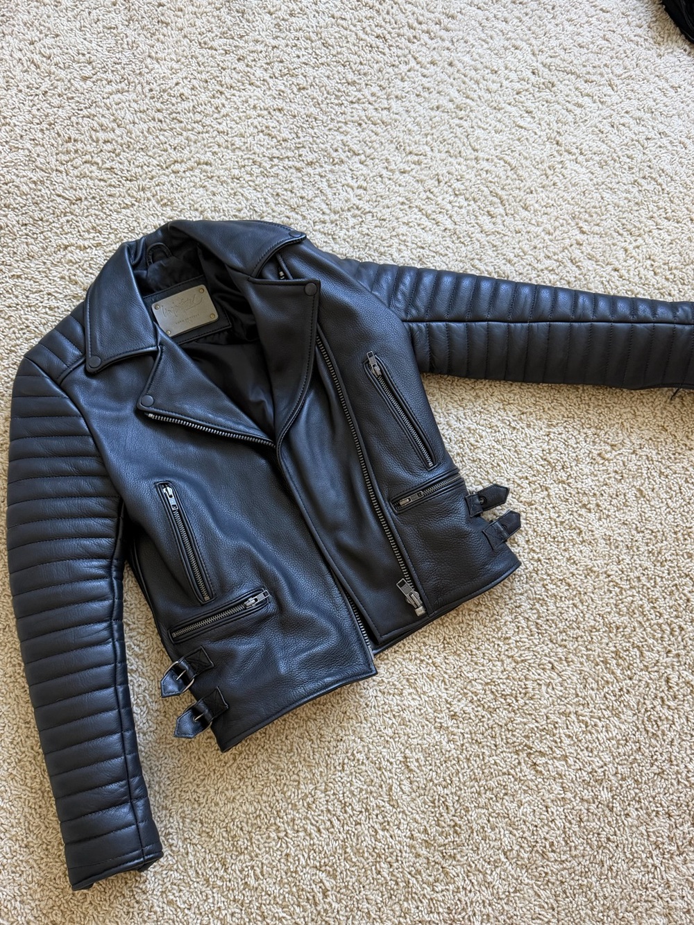 Understated black leather moto jacket